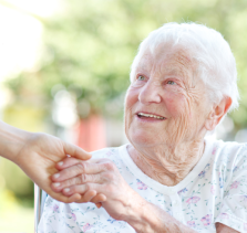 senior woman shaking hands provider of at home care in Gresham shaking hands with elderly woman
