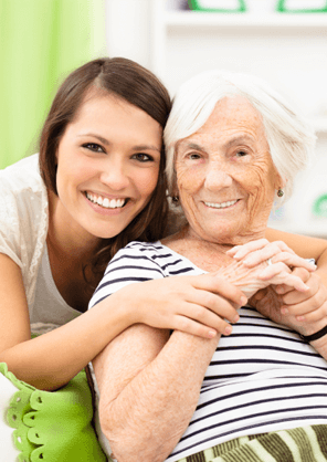 staff from home care providers in Tri-Cities sitting with elderly patient